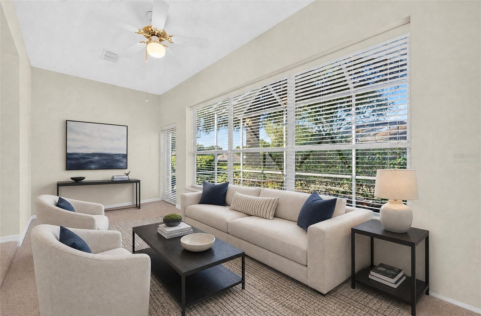 Just off the Living Room, a BONUS SUNROOM offers a bright and relaxing retreat overlooking the BACKYARD PATIO AND LANAI. Virtually Staged