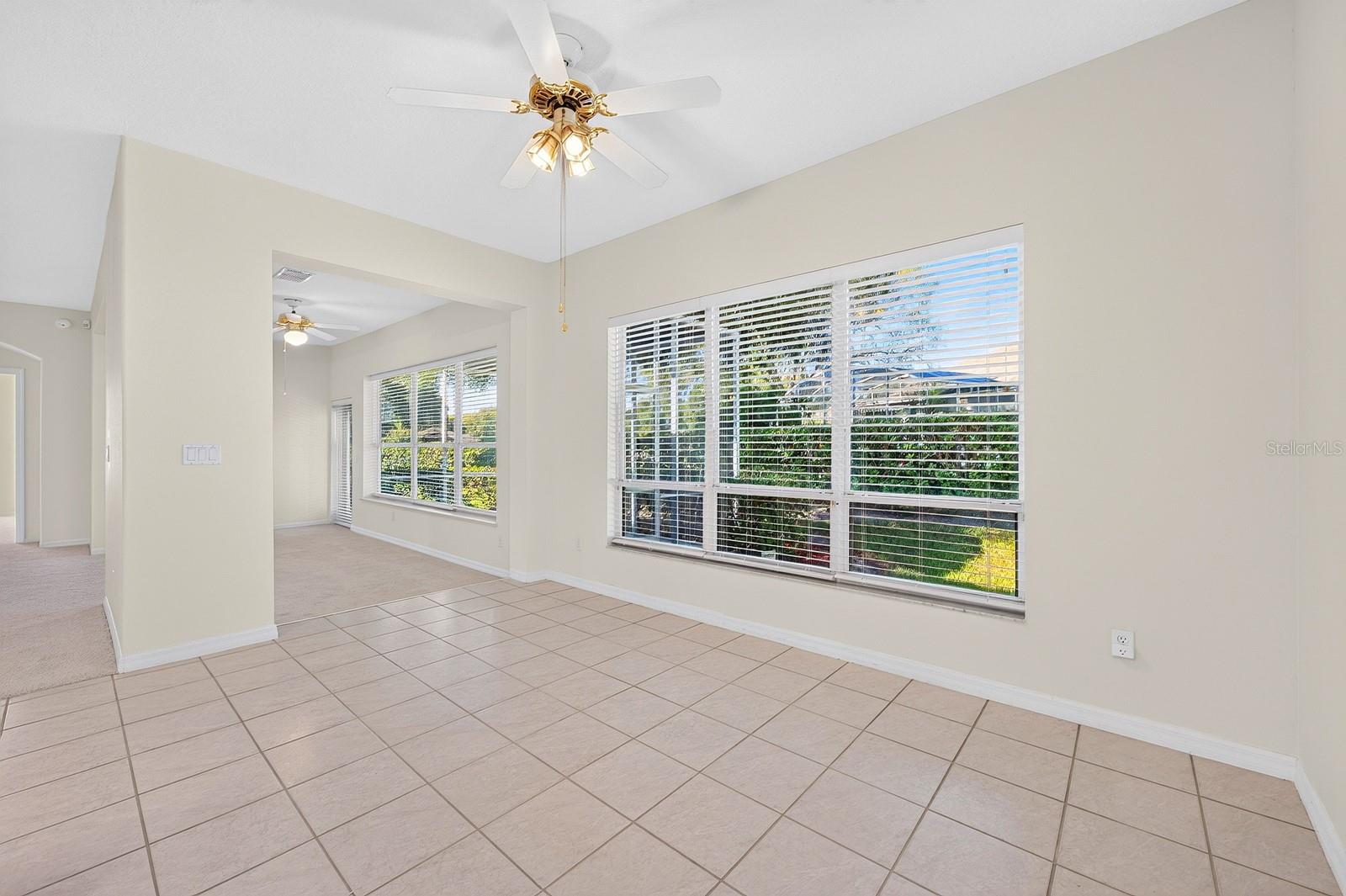 Framed by a large window overlooking the backyard, the SUNNY BREAKFAST NOOK is an inviting place to enjoy a leisurely breakfast or catch up over a cup of coffee.