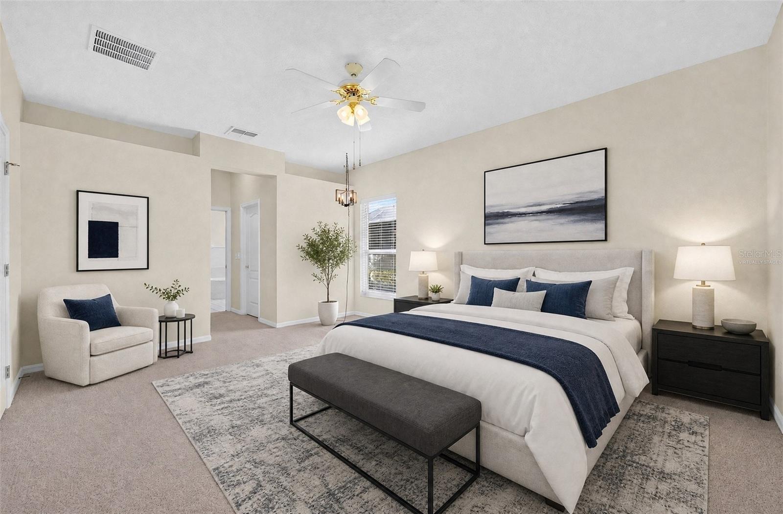 The PRIMARY SUITE provides a comfortable place to unwind, with DUAL WALK-IN CLOSETS and a PRIVATE EN SUITE BATH. Virtually Staged