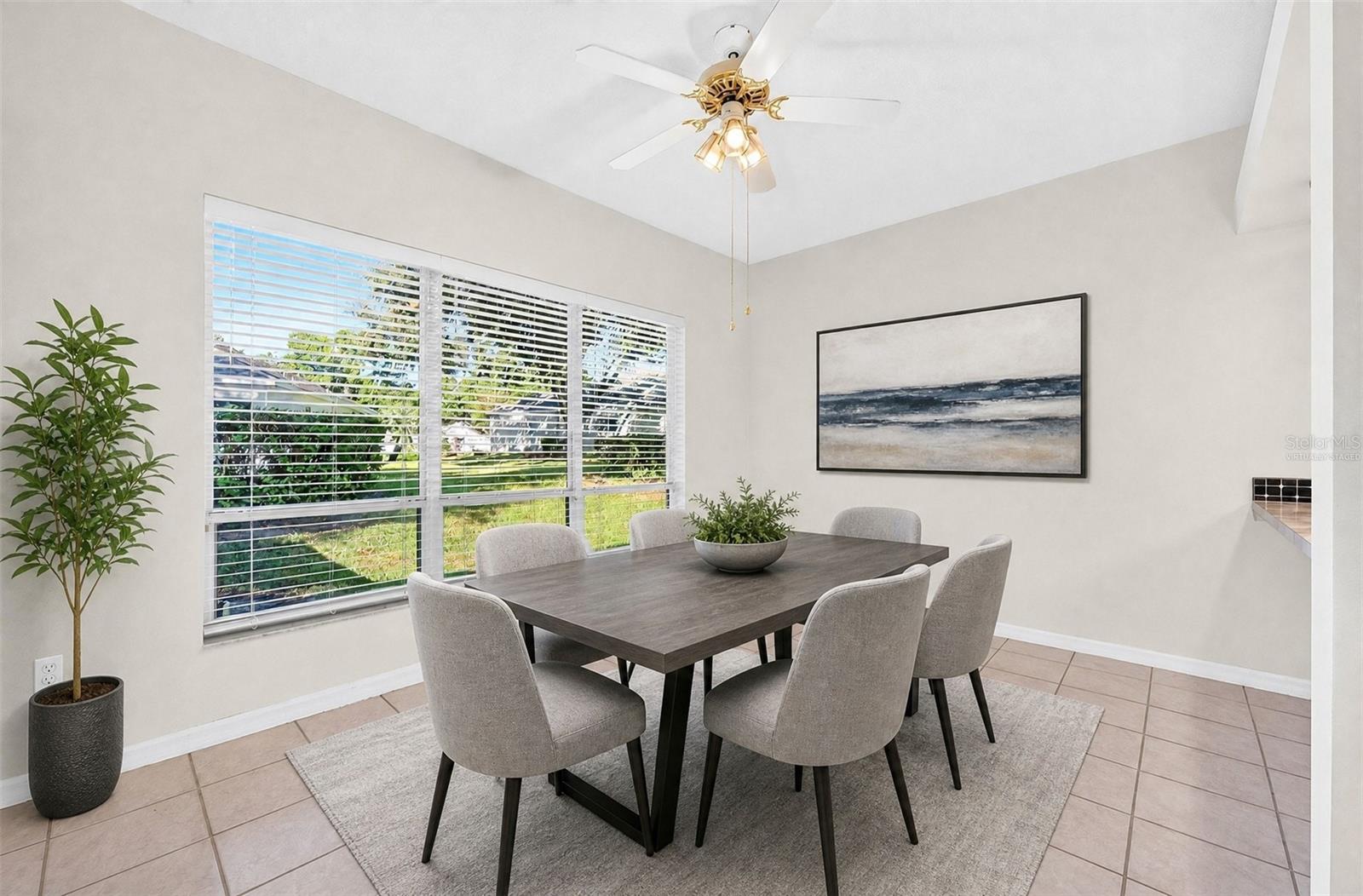Framed by a large window overlooking the backyard, the SUNNY BREAKFAST NOOK is an inviting place to enjoy a leisurely breakfast or catch up over a cup of coffee. Virtually Staged