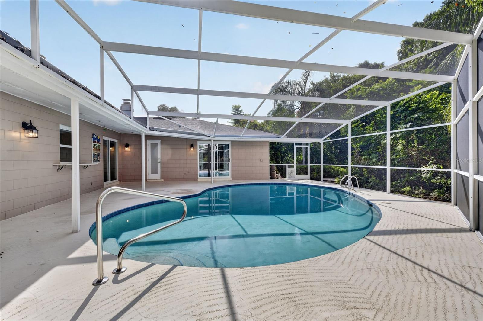 Screened pool with pass thru window from kitchen