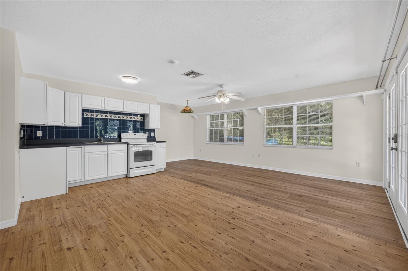 Living room, eat-in space space and kitchenette in in-law suite