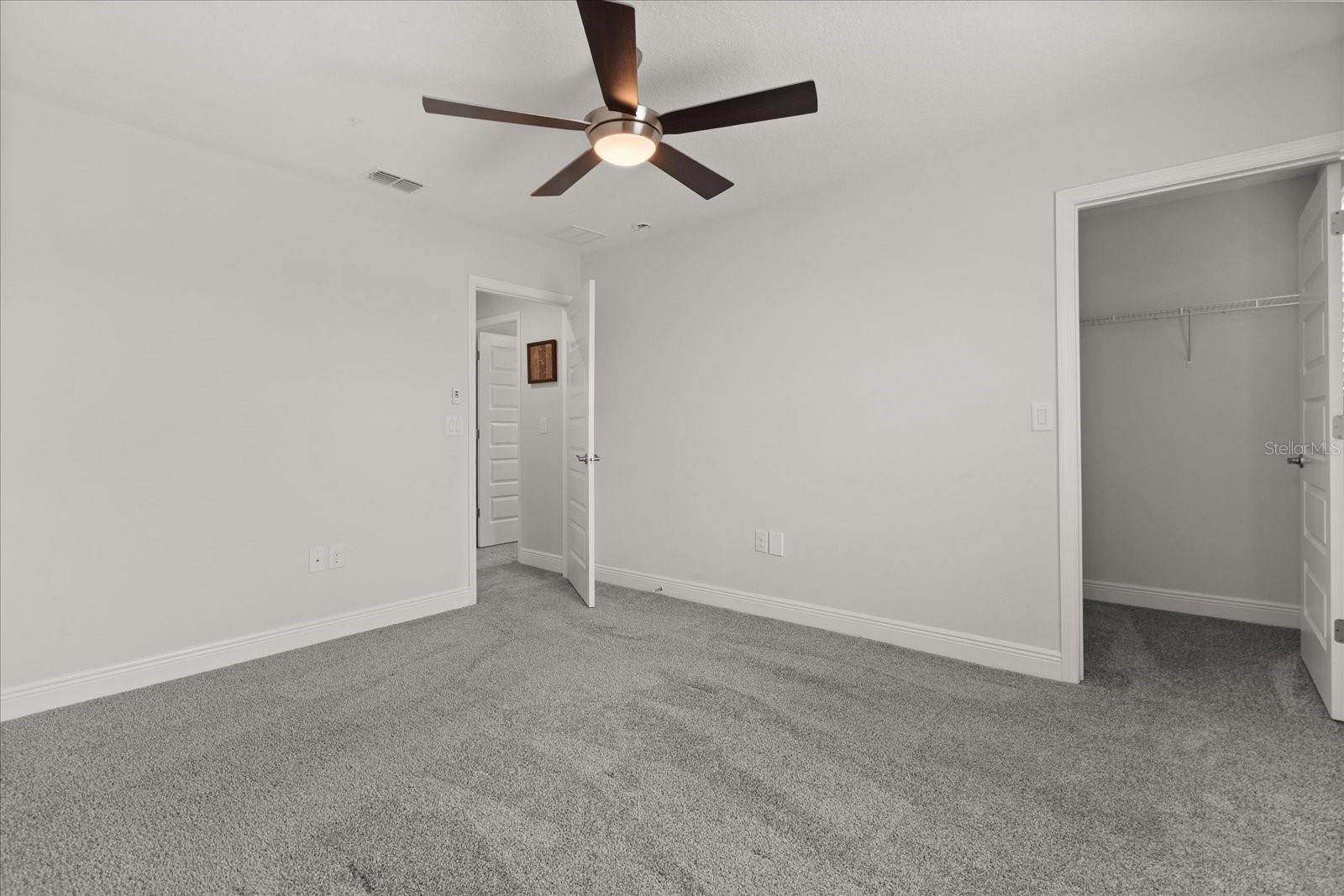 Upstairs bedroom 2with walk in closet and in-suite bathroom