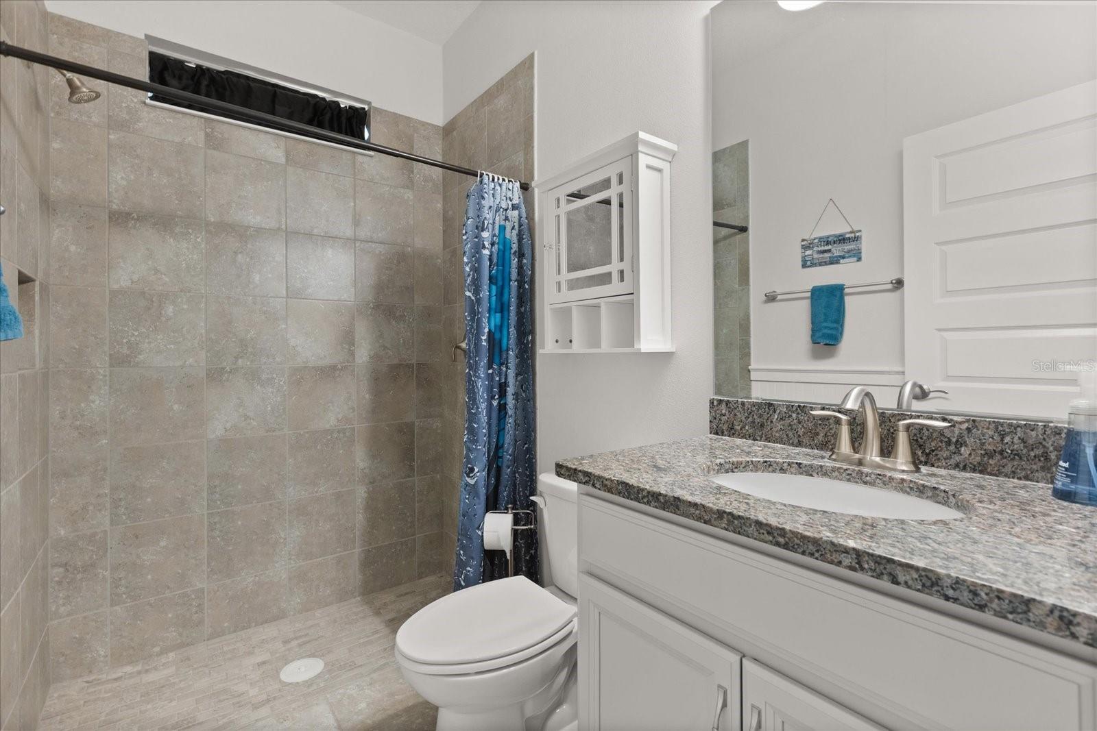Downstairs full bath next to 1st floor bedroom