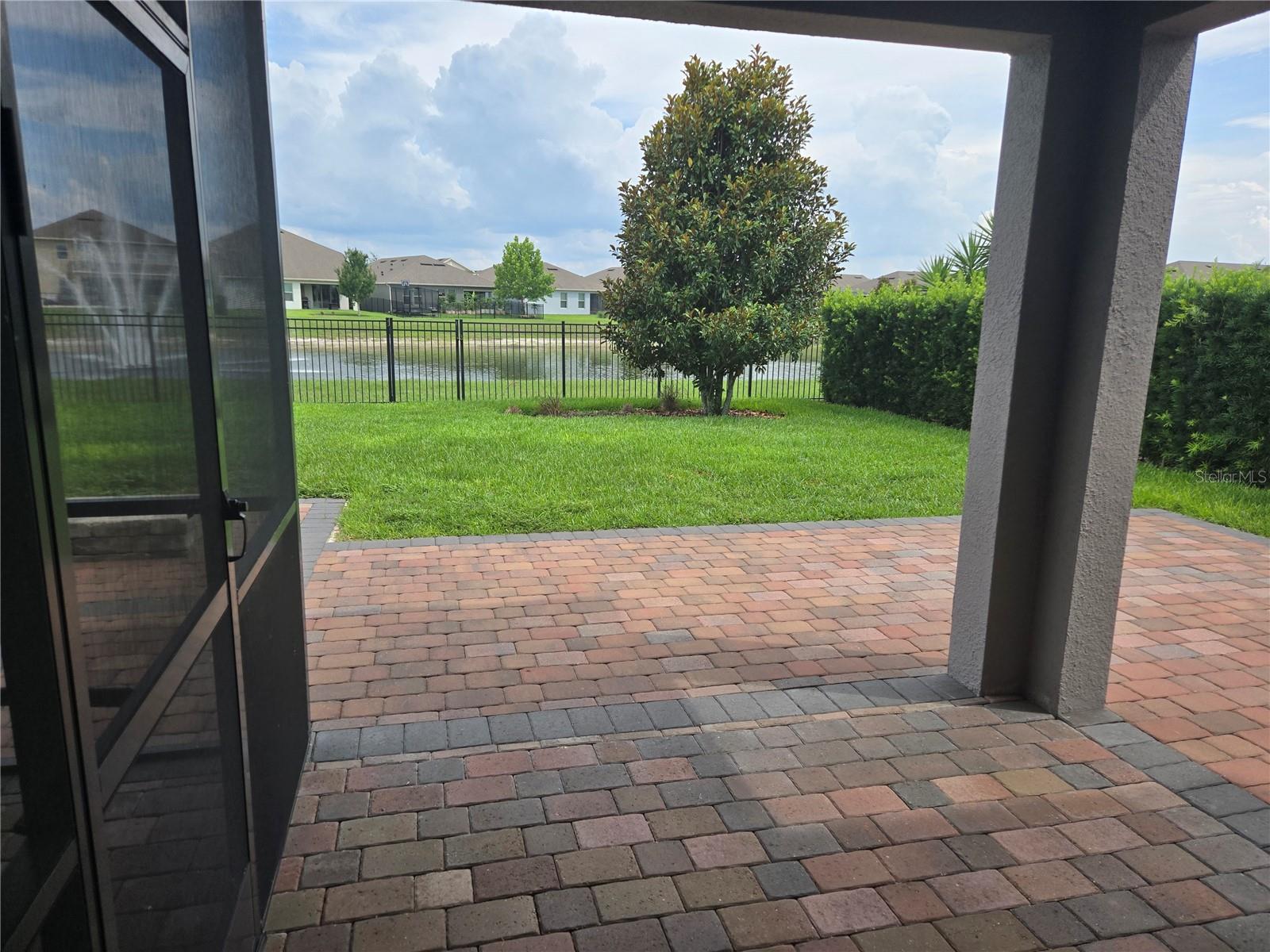 covered back porch with screened in porch to left