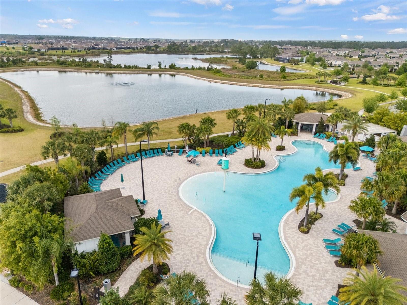 Huge neighborhood Pool behind clubhouse overlooking beautiful lake