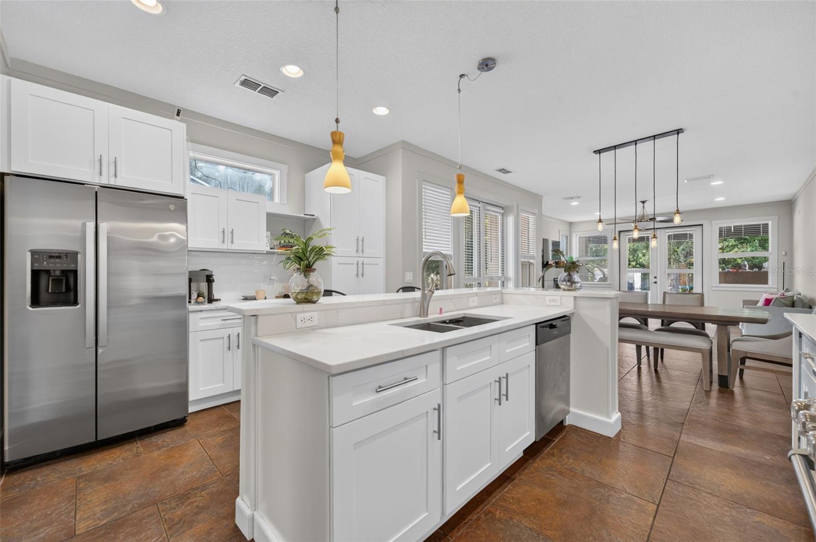 Kitchen area with extra storage around fridge