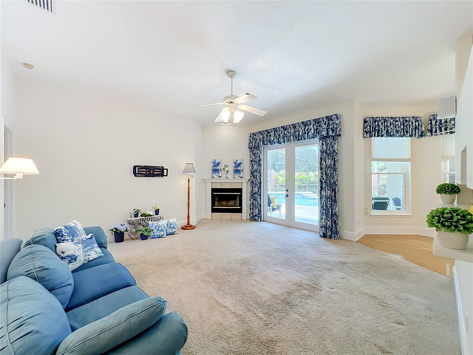 FAMILY ROOM WITH FRENCH DOORS TO POOL LANAI