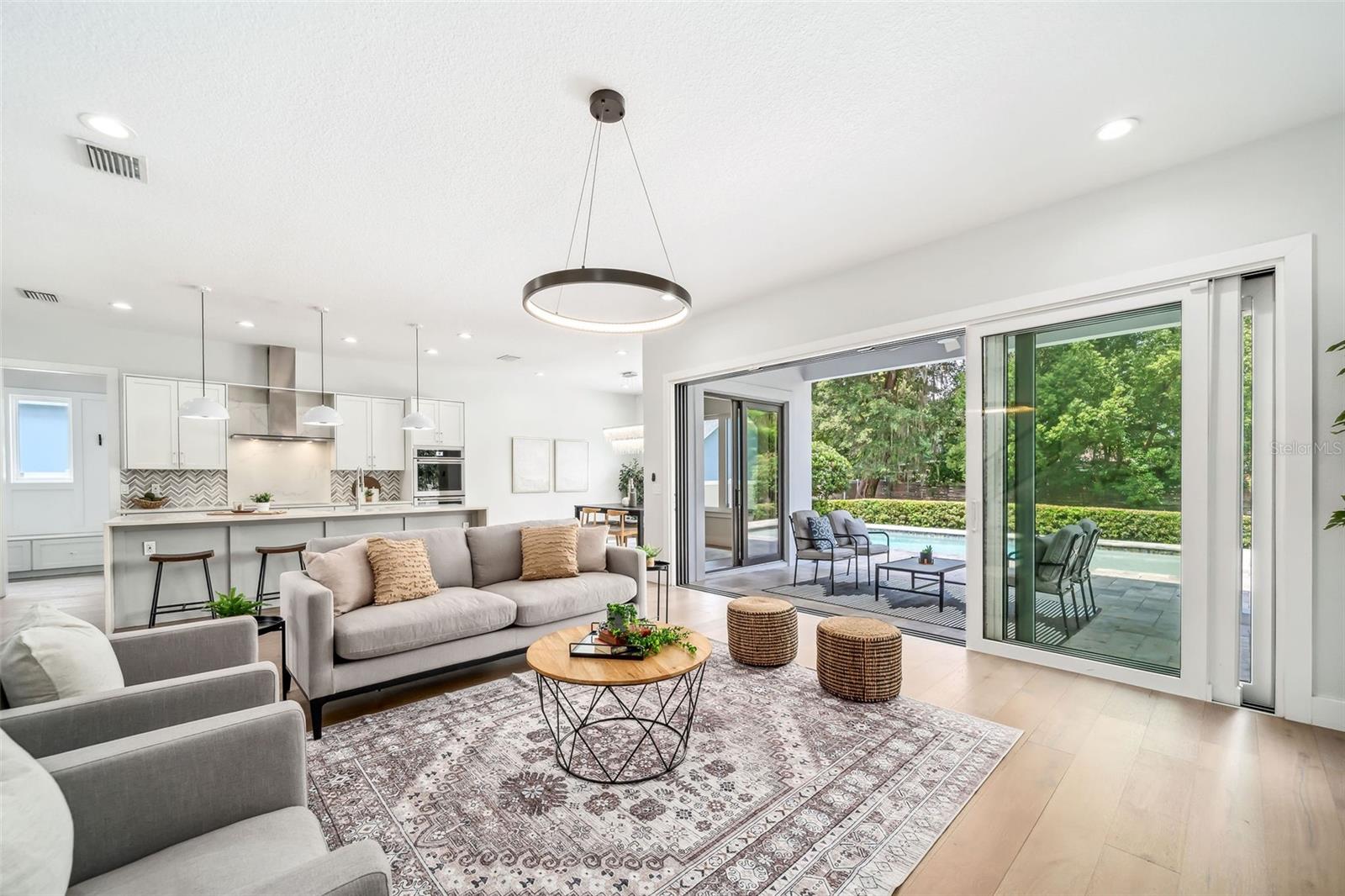 Glass Sliding doors lead to lanai and pool area