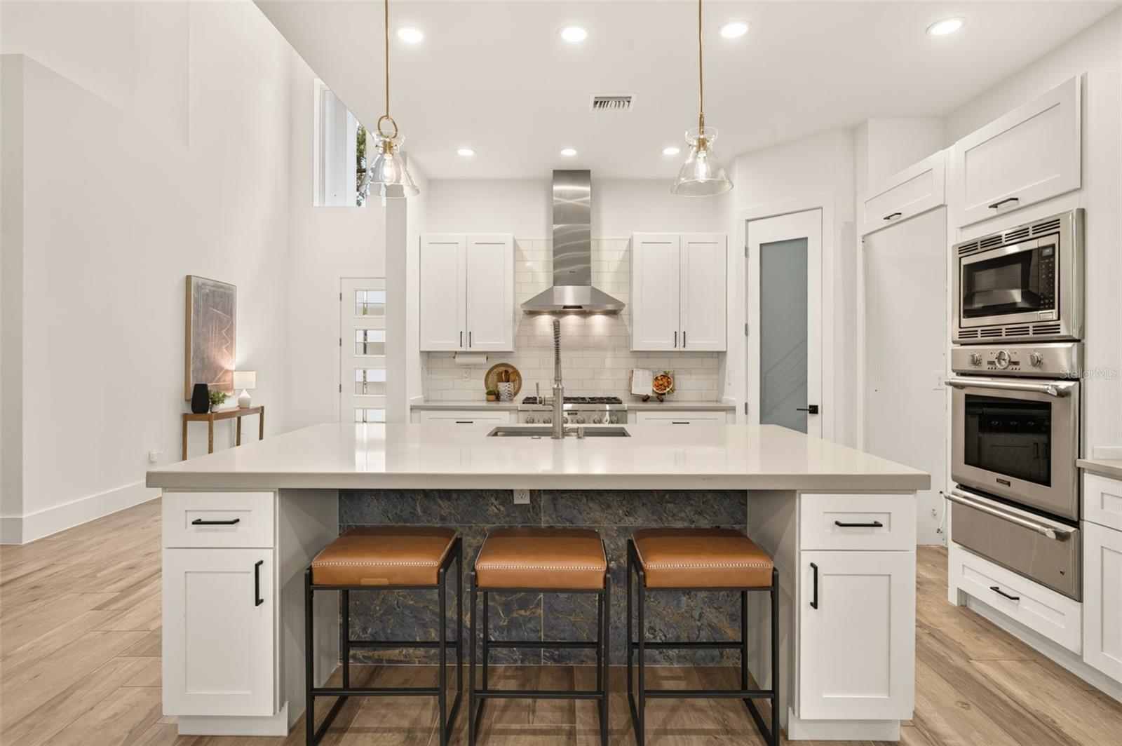 Large island w/ space for seating- overlooks dining/living area