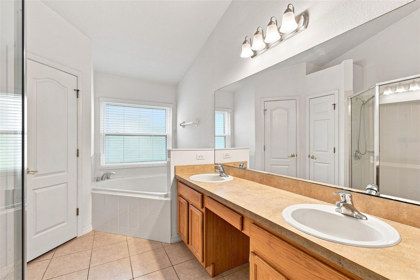 Primary Bath has Dual Vanities, Separate Shower and Tub