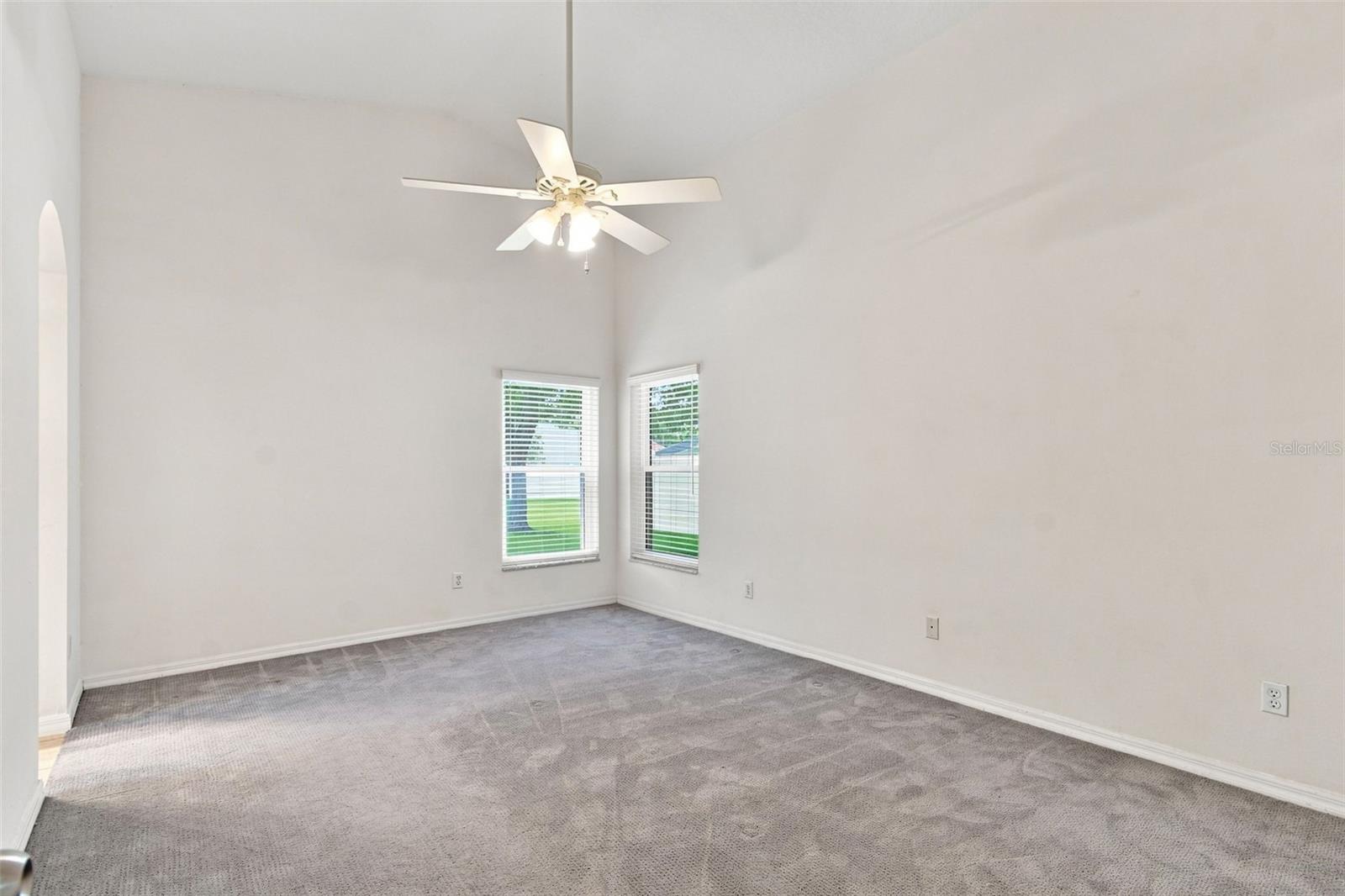 Primary Owner's Suite with Volume Ceiling and Ceiling Fan