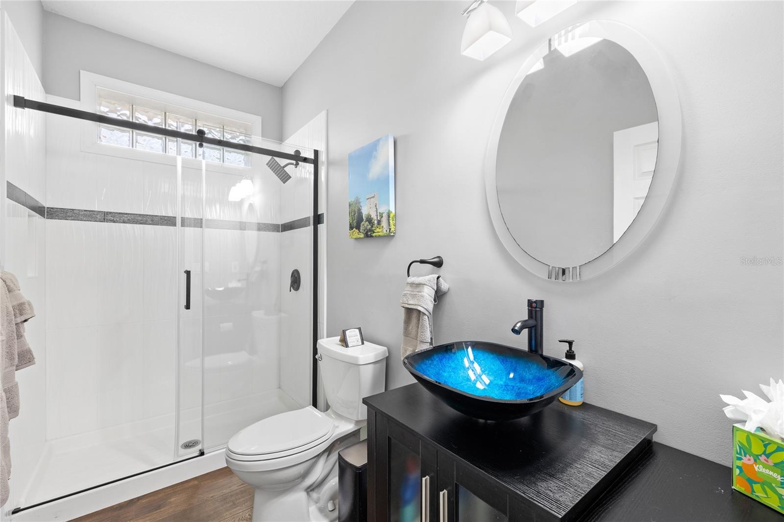 Downstairs full bathroom with walk in shower/ pool bath