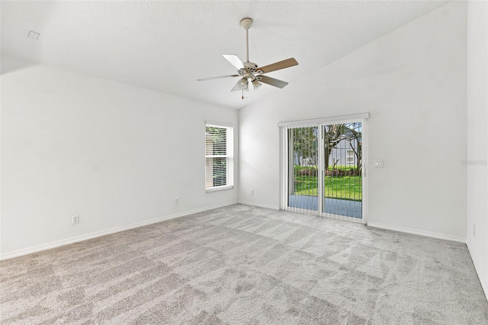 Family Room with Volume Ceilings and Fan