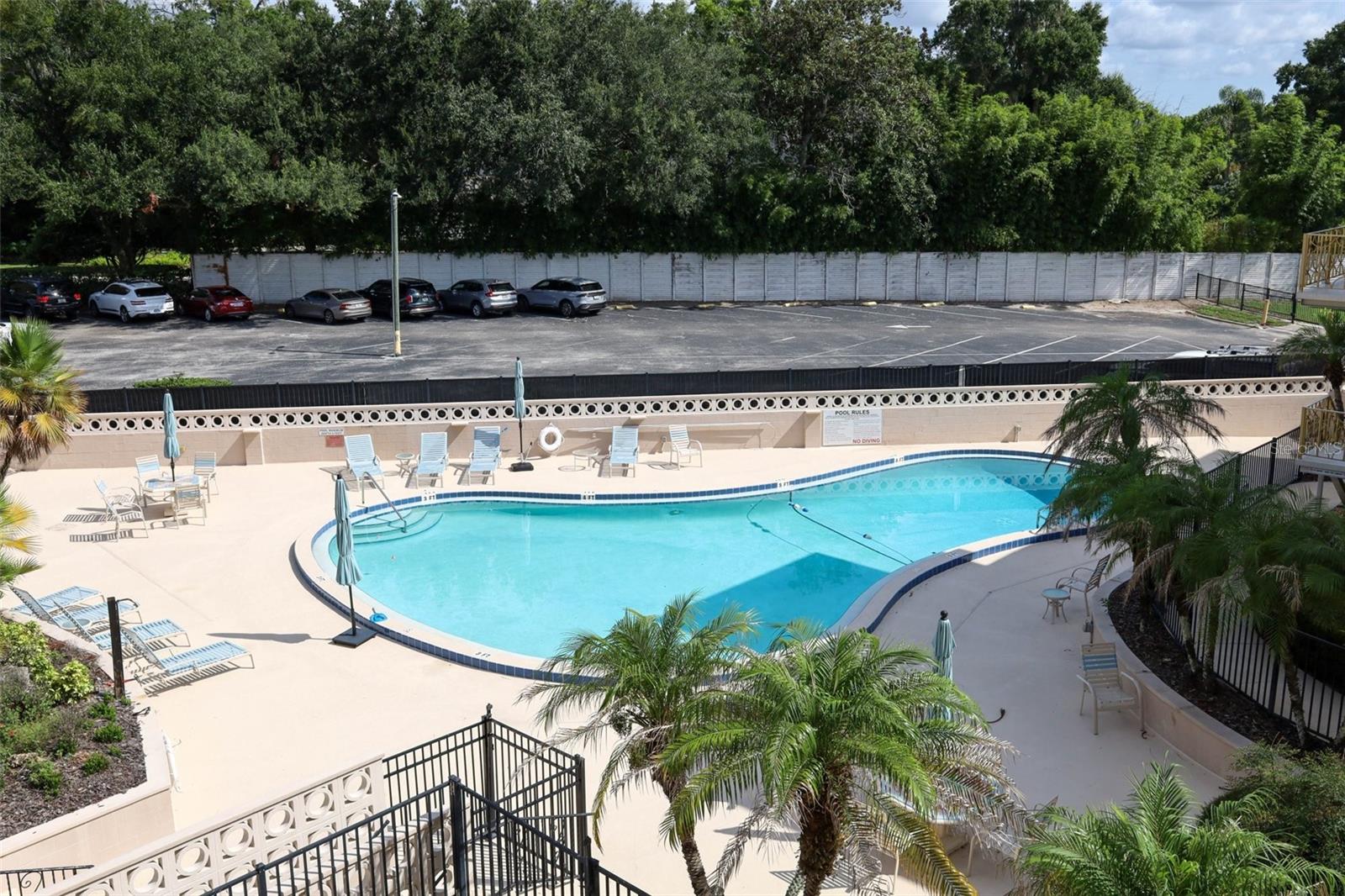 Community pool steps from the back of the unit