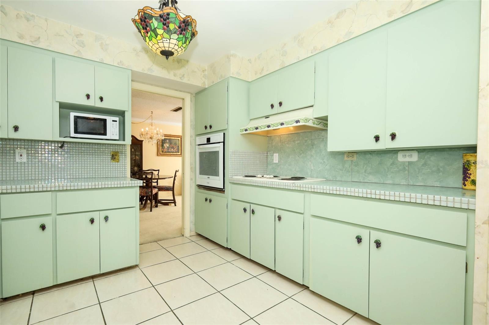 Kitchen with cooktop with separate oven