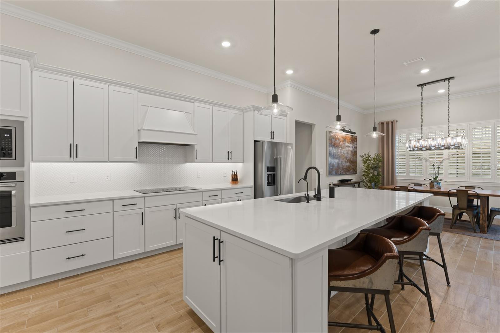 Statuario quartz, and 42" soft-close cabinets.