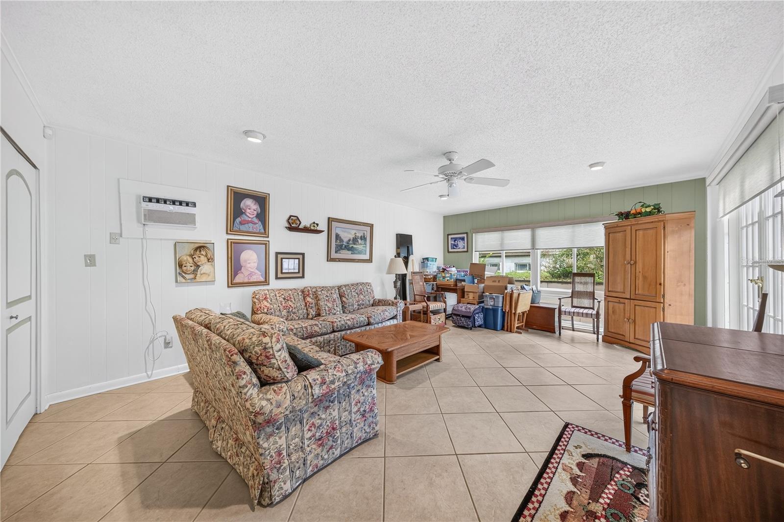 Family room with a pool view.