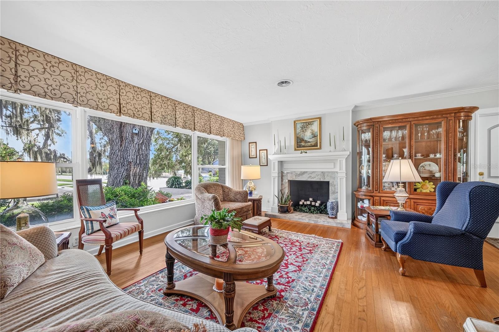 Living room with wood burning fireplace. Living room with wood burning fireplace.