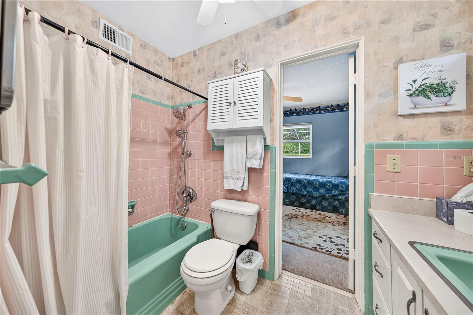 Full bath shared with Primary and bedroom #2.
