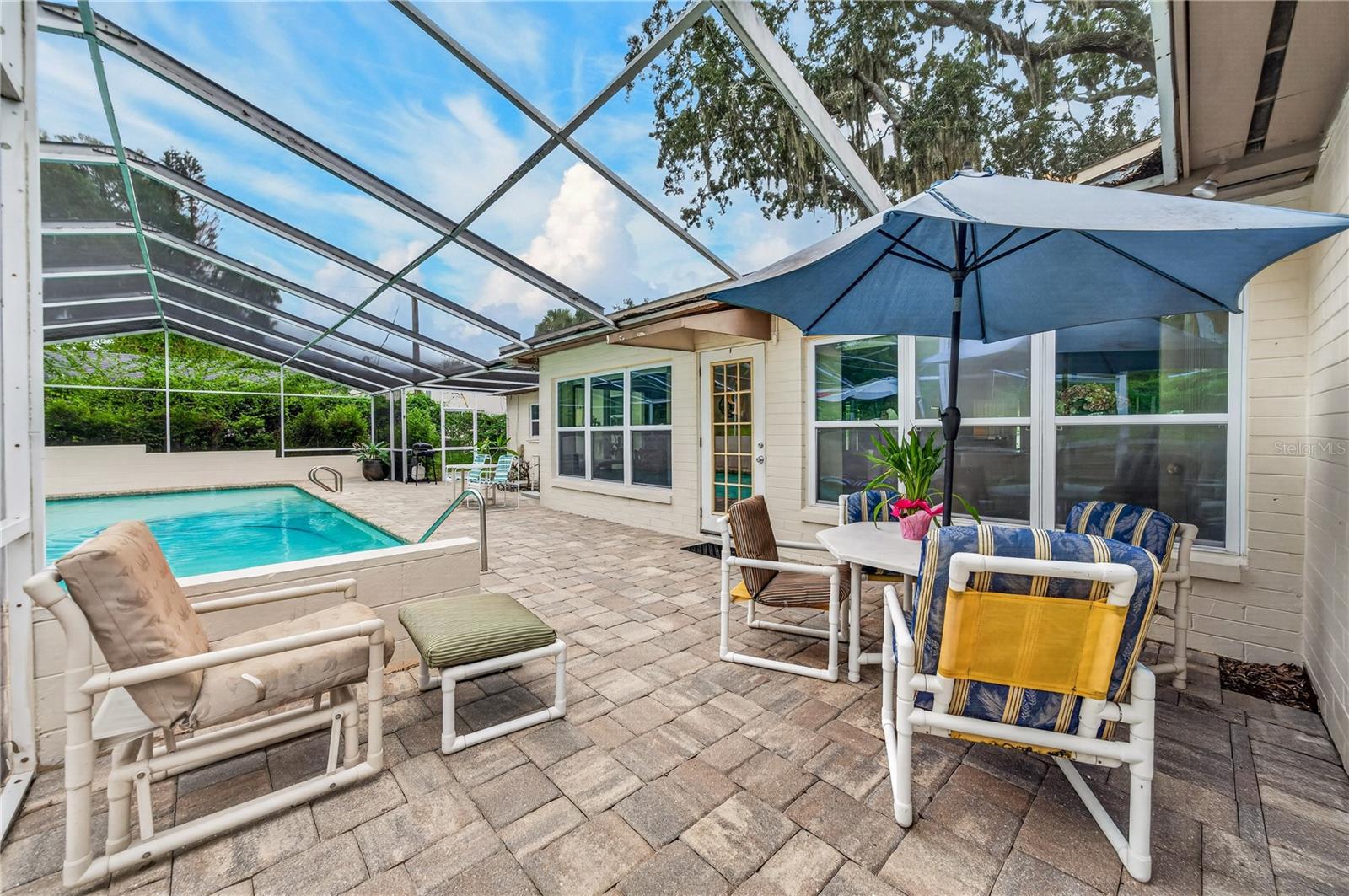 Pool deck with pavers.