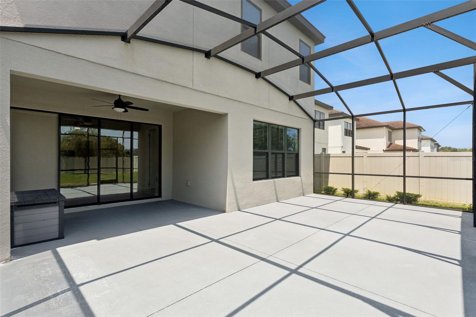 Screened Outdoor Living  Spacious screened patio offers a generous covered area with direct access to the interior and plenty of room for outdoor seating and dining.