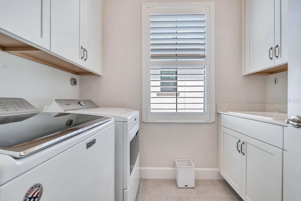 Laundry room with sink & storage cabinets