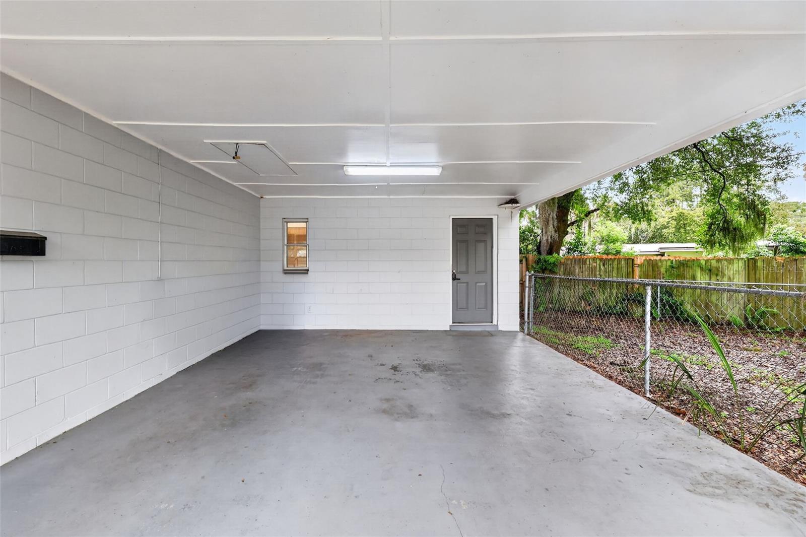 Nice Covered Carport With Convenient Side Entry To The Home