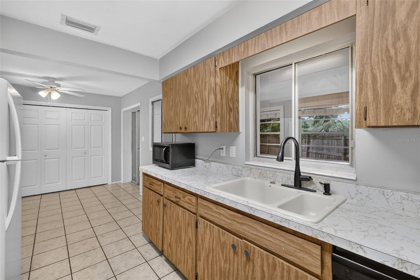 Dining Area Conveniently Located Next to Kitchen-Window View/Access Into Florida Room From Kitchen