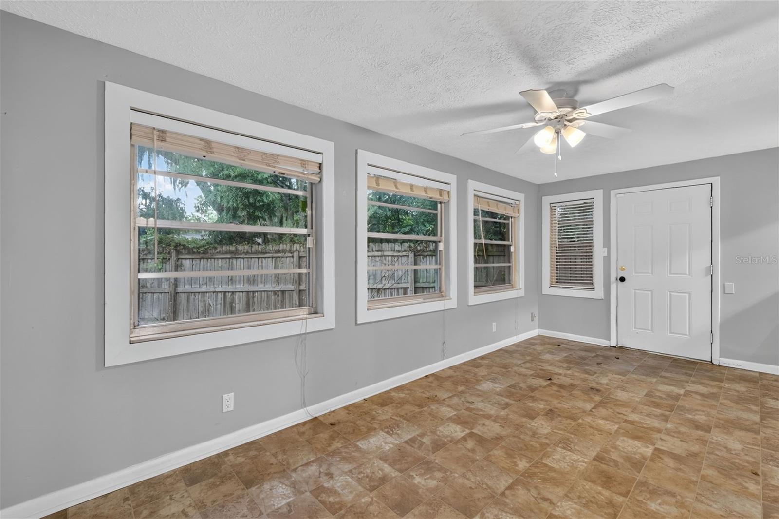 Bonus/Florida Room Provides Direct Access To the Fenced Back Yard