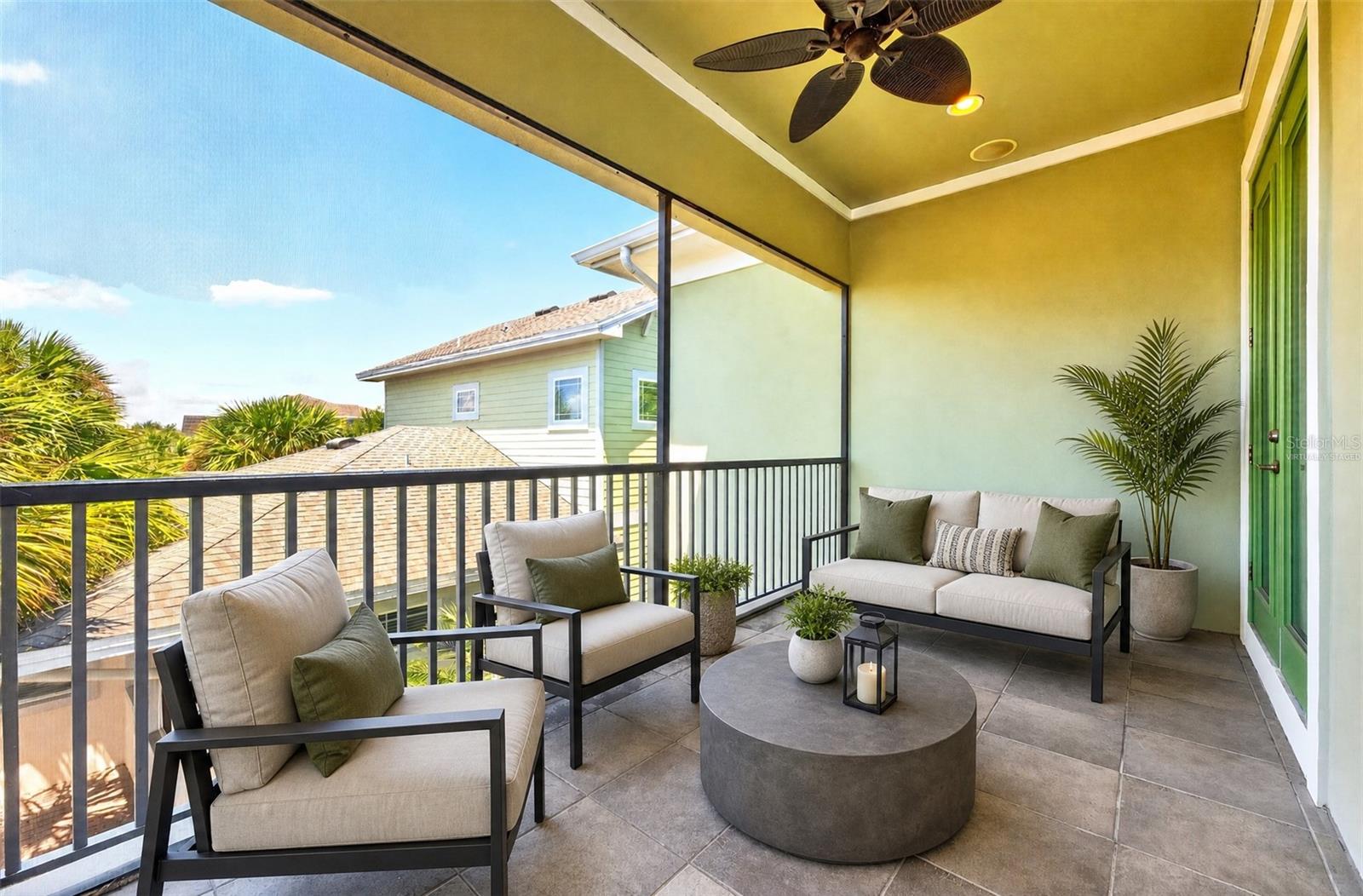 Your primary suite is complete with a private balcony. Virtually Staged.