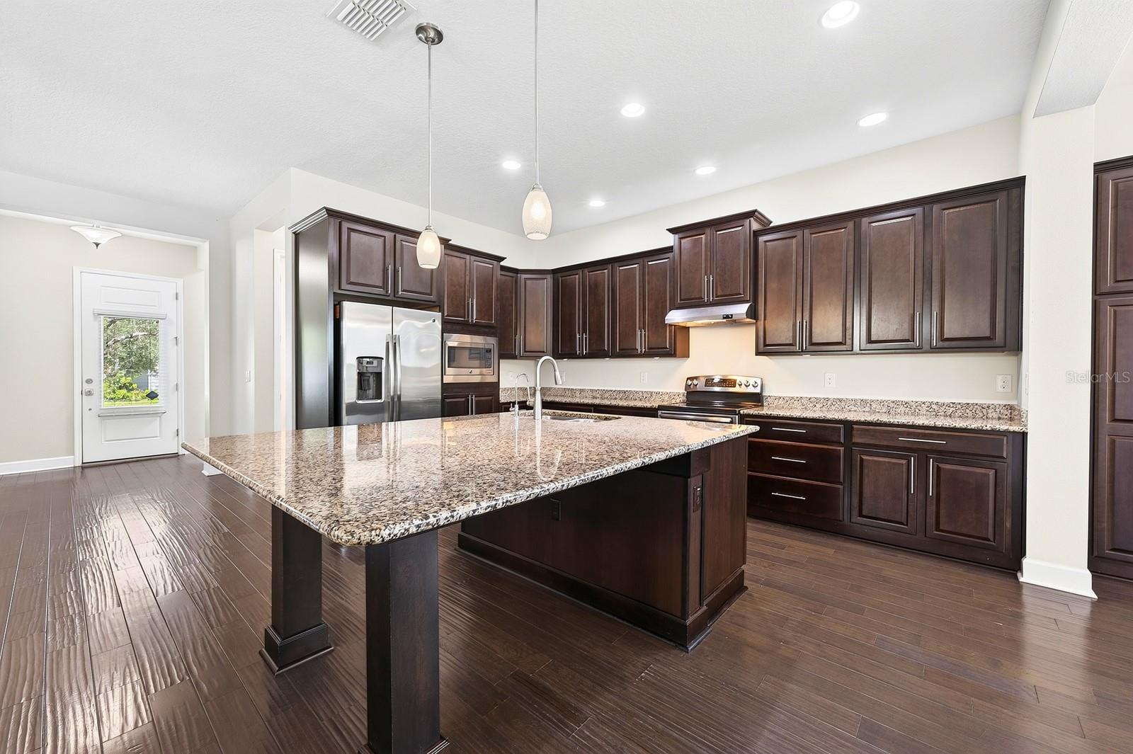 Beautifully designed and thoughtfully upgraded, this Huxley Grande model by Minto offers 3 bedrooms, a dedicated OFFICE/FLEX SPACE, 2-full and 1-half baths, and a 2-CAR REAR FACING GARAGE, all wrapped in the LOW MAINTENANCE lifestyle Laureate Park is known for.