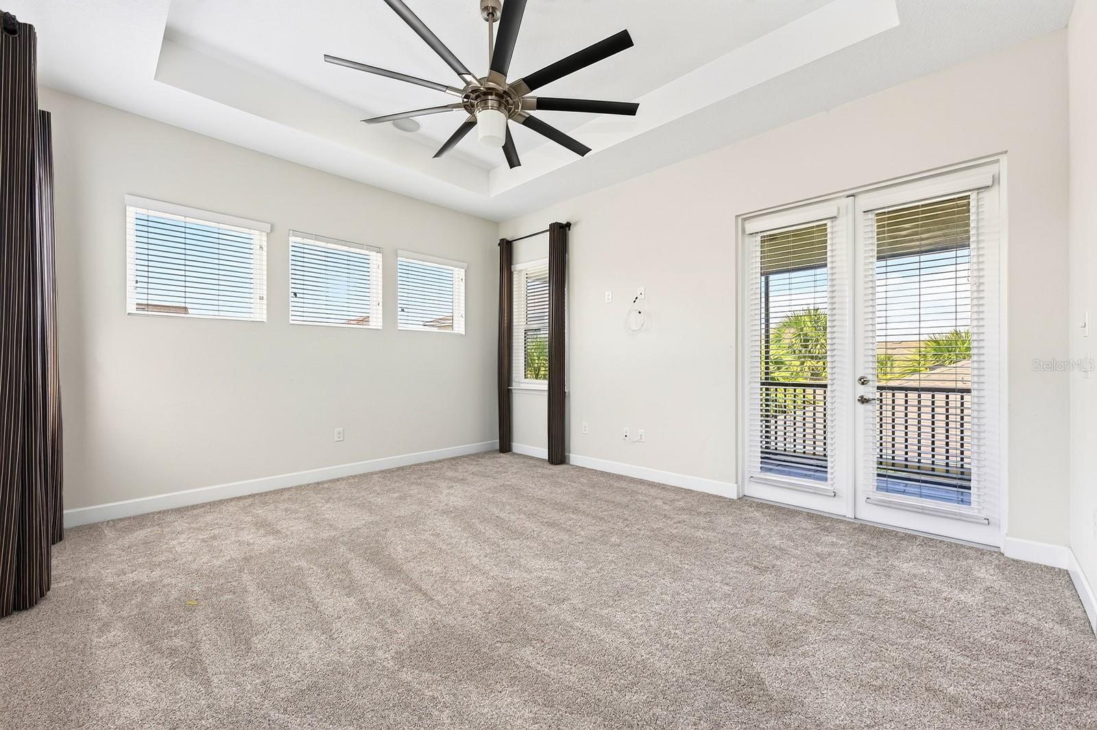 French doors off the primary suite open to a private balcony.