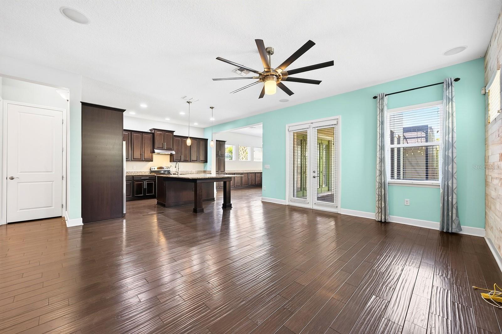 The OPEN CONCEPT living, dining, and kitchen spaces are filled with NATURAL LIGHT and designed for effortless everyday living and entertaining.