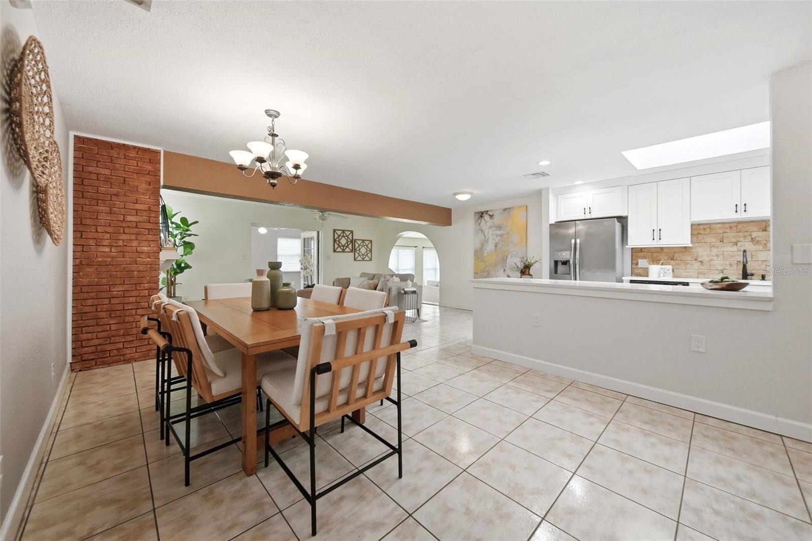 Formal dining room, living room, fireplace.