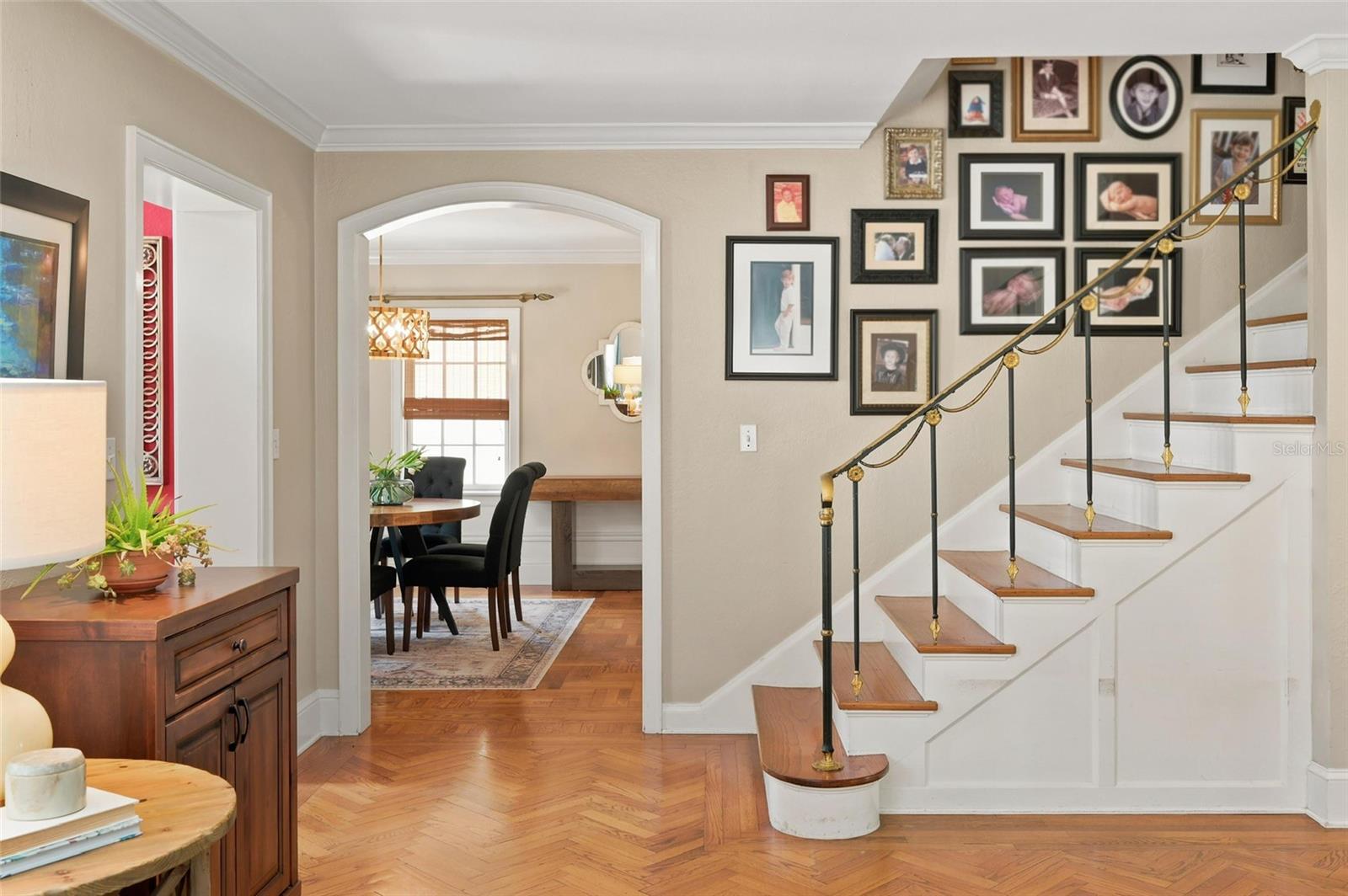 Welcoming Foyer with Hardwood Floors & Staircase