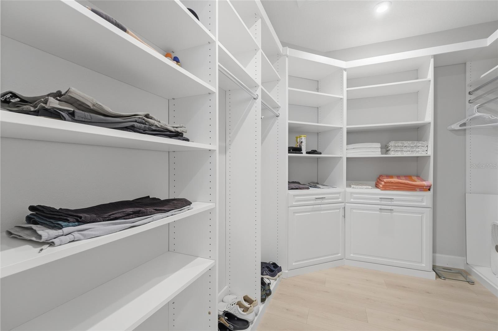 Oversized M/B walk-in closet custom built- in shelving