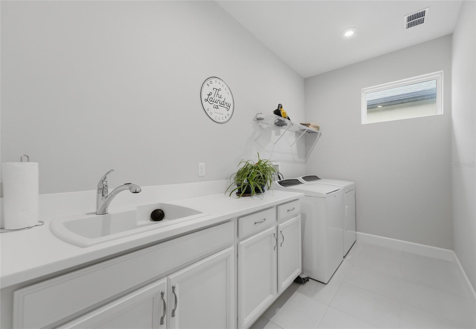 Inside Laundry room w/mop sink and lots of space