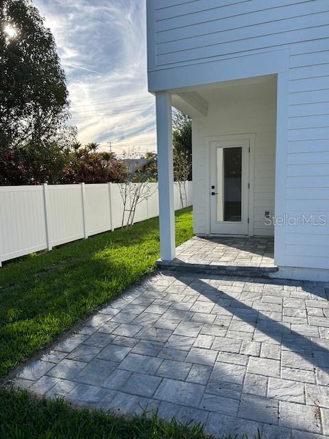 back covered patio with storage closet