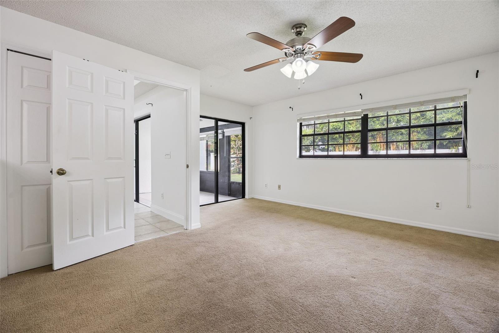 Primary bedroom with access to patio/lanai