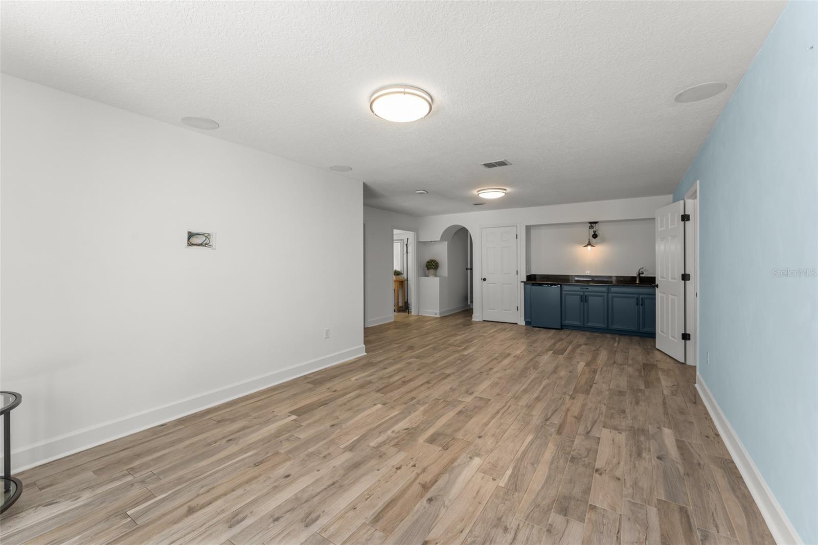 Downstairs wet bar with mini fridge..