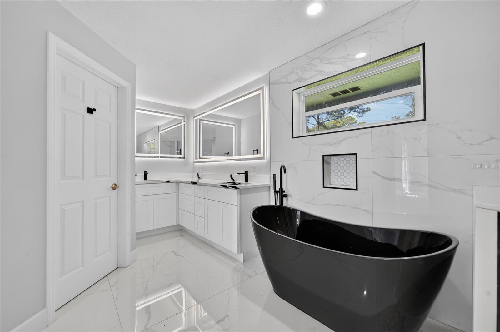 Updated Flooring, Soaking Tub, Vanity, Quartz countertops