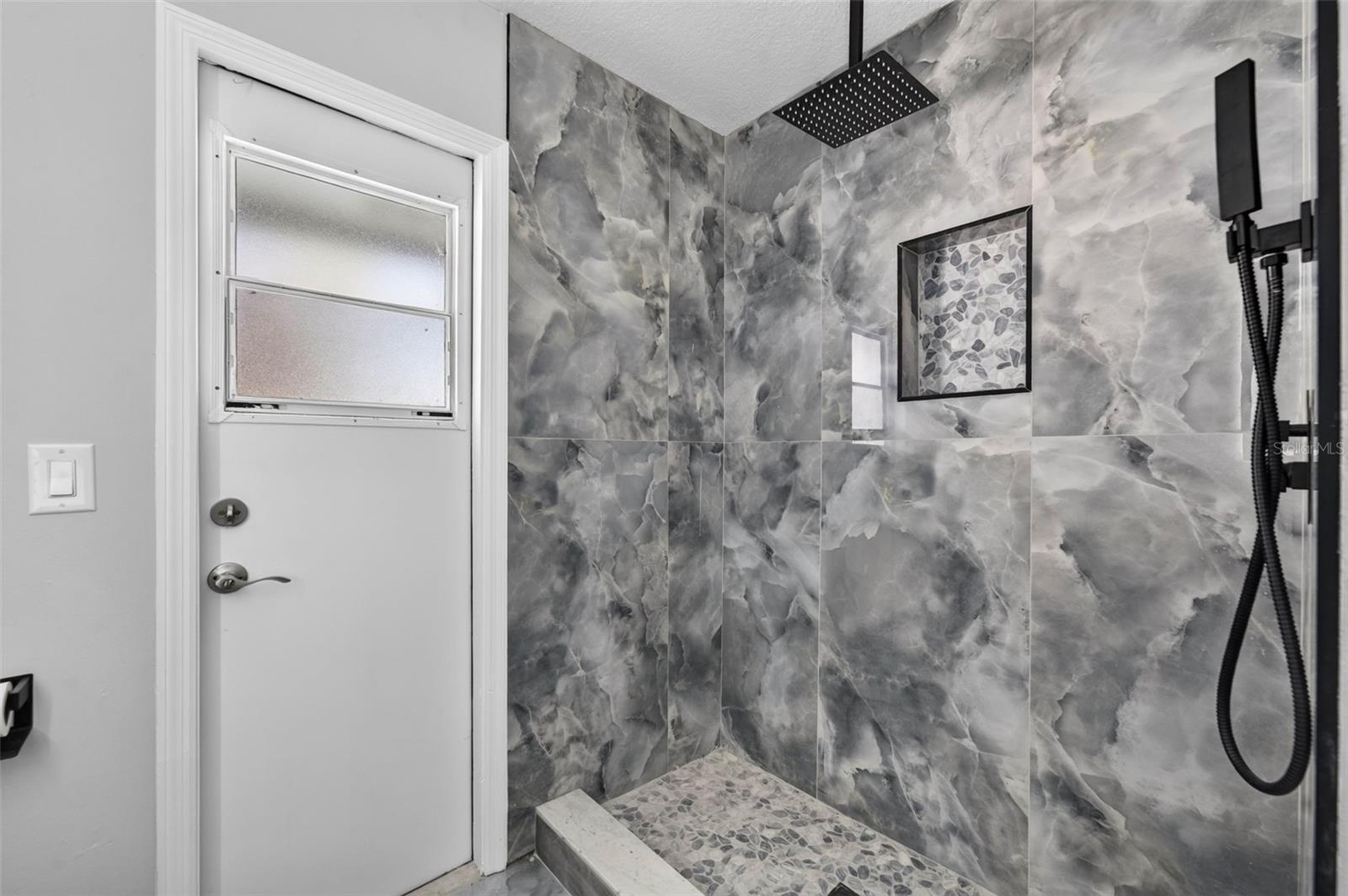 Updated Tile, Fixtures and stone tile flooring.