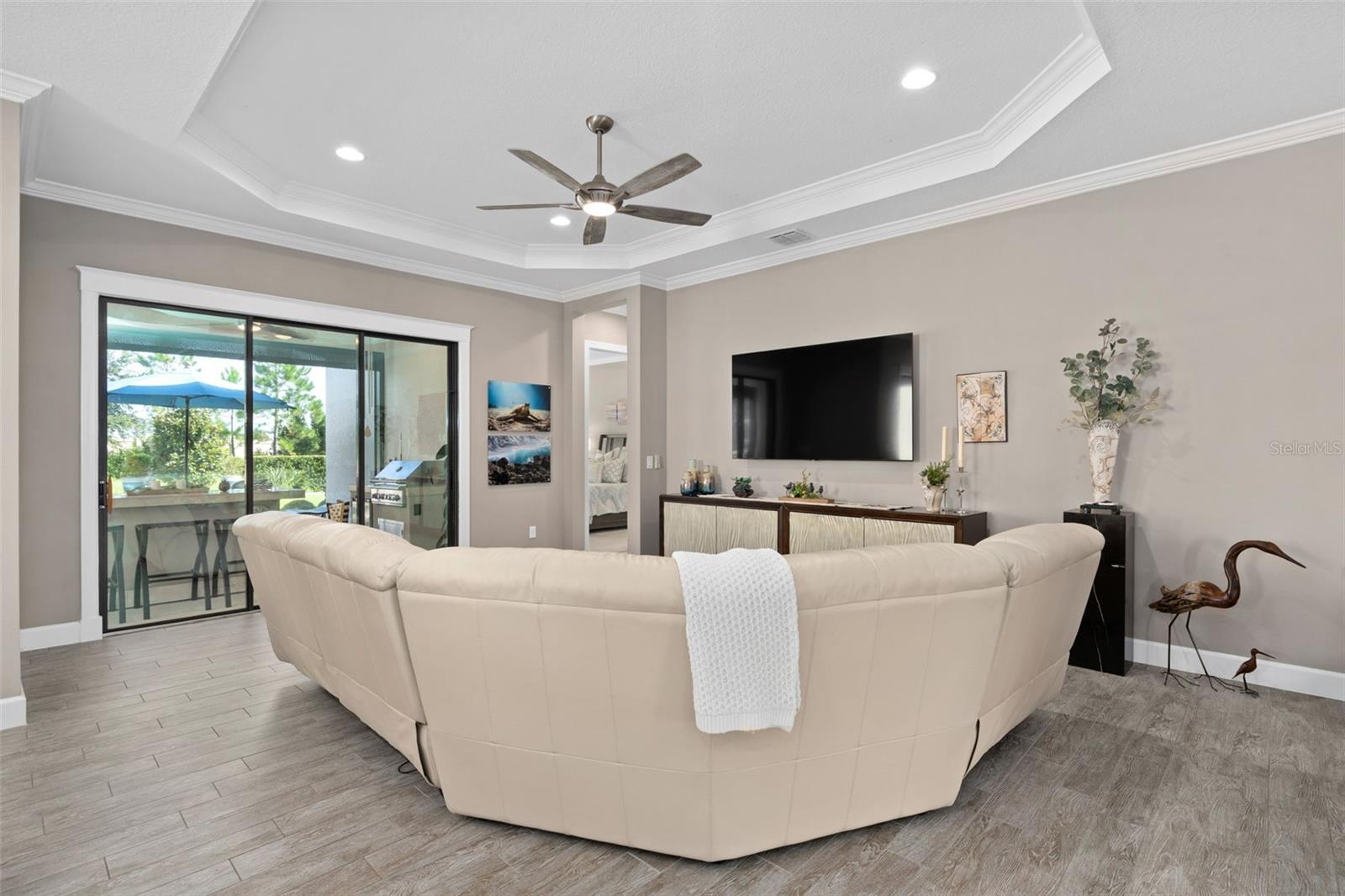 Great room with a view of the screened lanai and the rear yard.