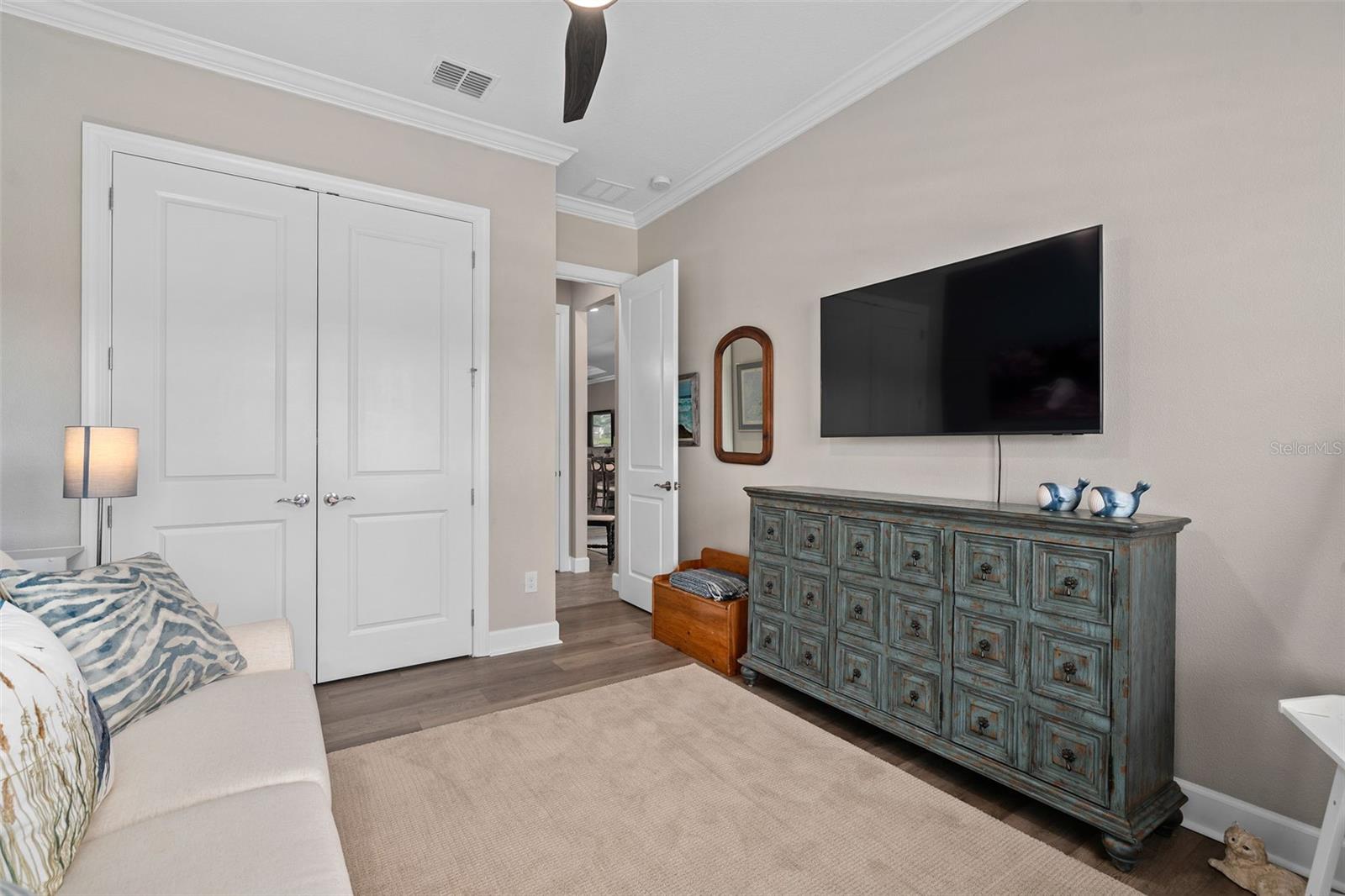 Bedroom 3 with a closet organization system.