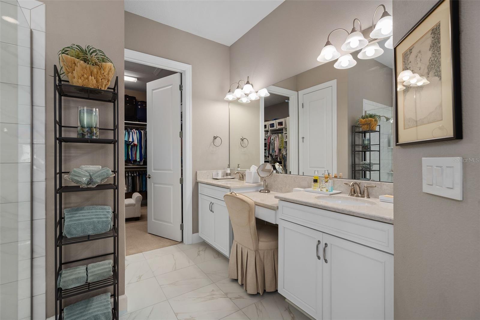 Primary En-Suite offering a larger walk-in closet, separate water closet and a walk-in shower.