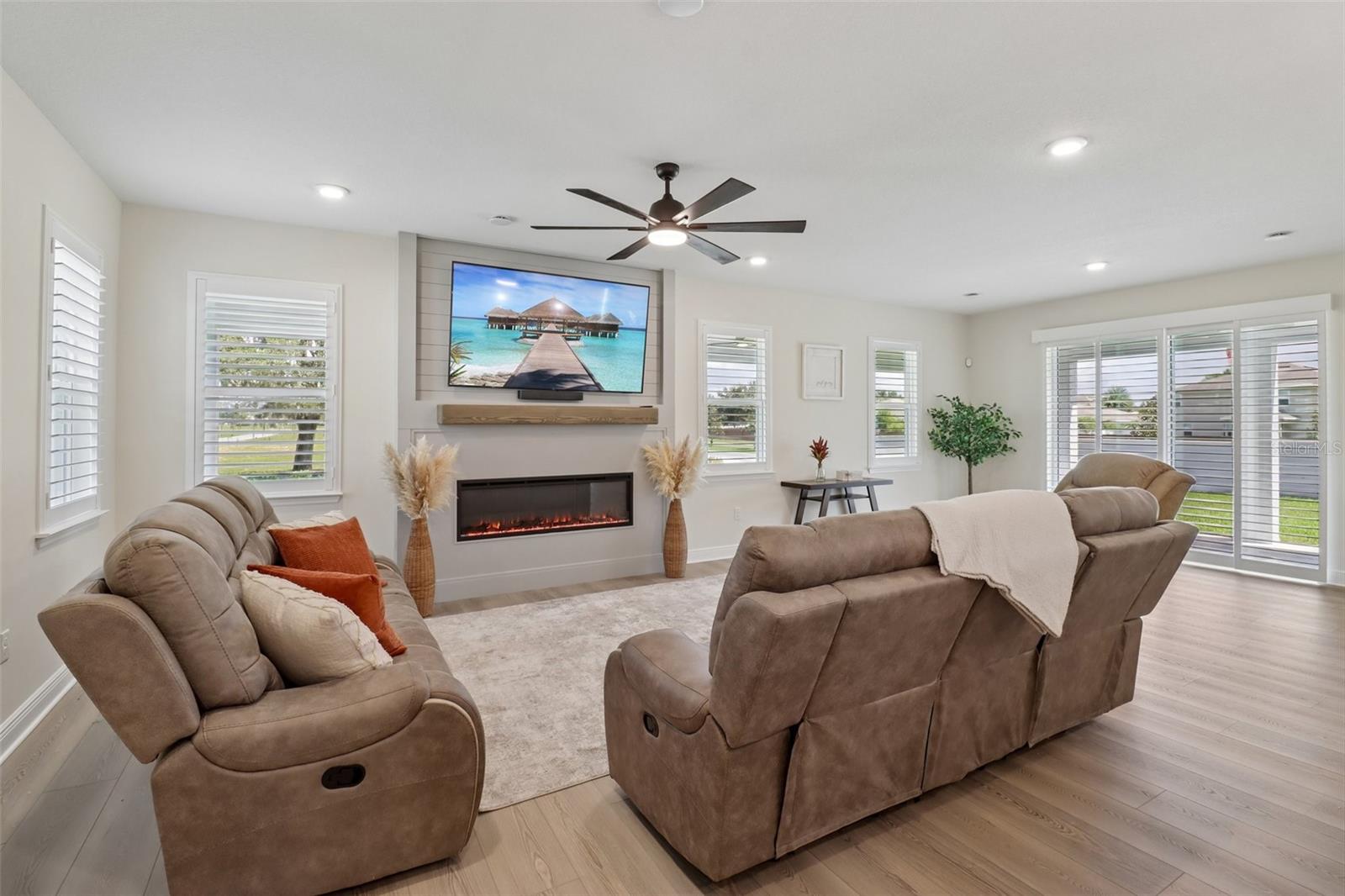 The generous living area is complete with feature fireplace. The generous living area is complete with feature fireplace.