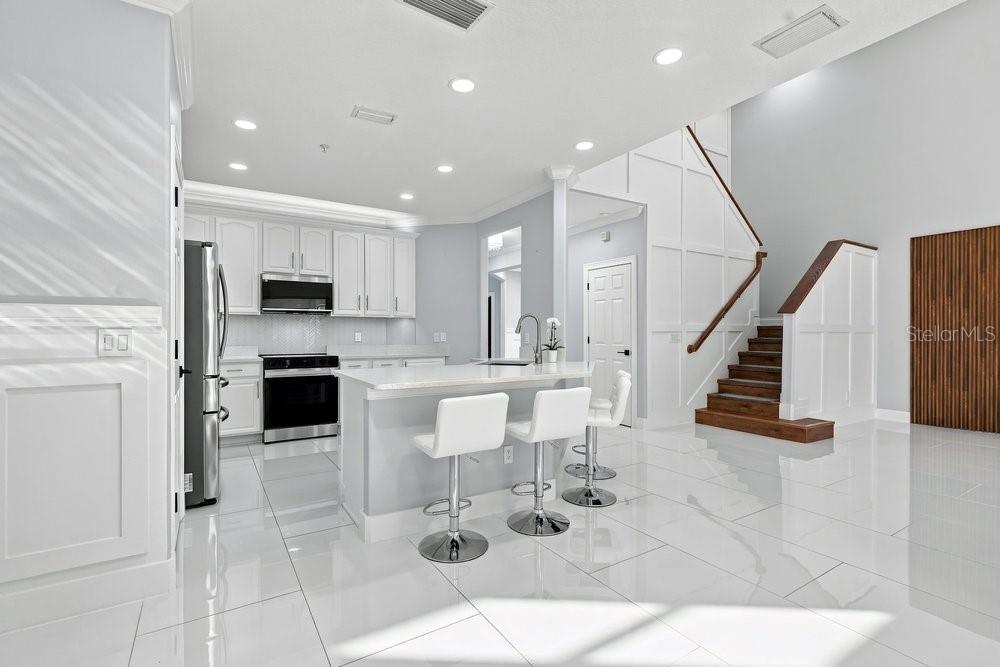 Porcelain tile throughout the first floor
