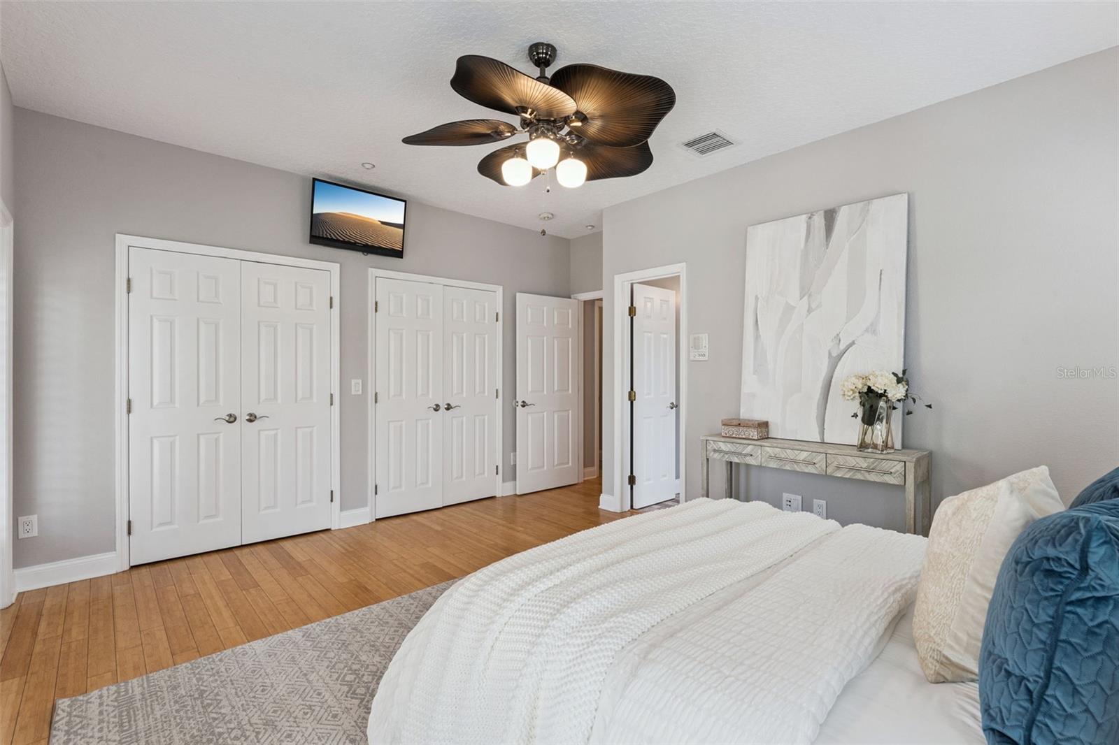 The primary suite features dual closets.