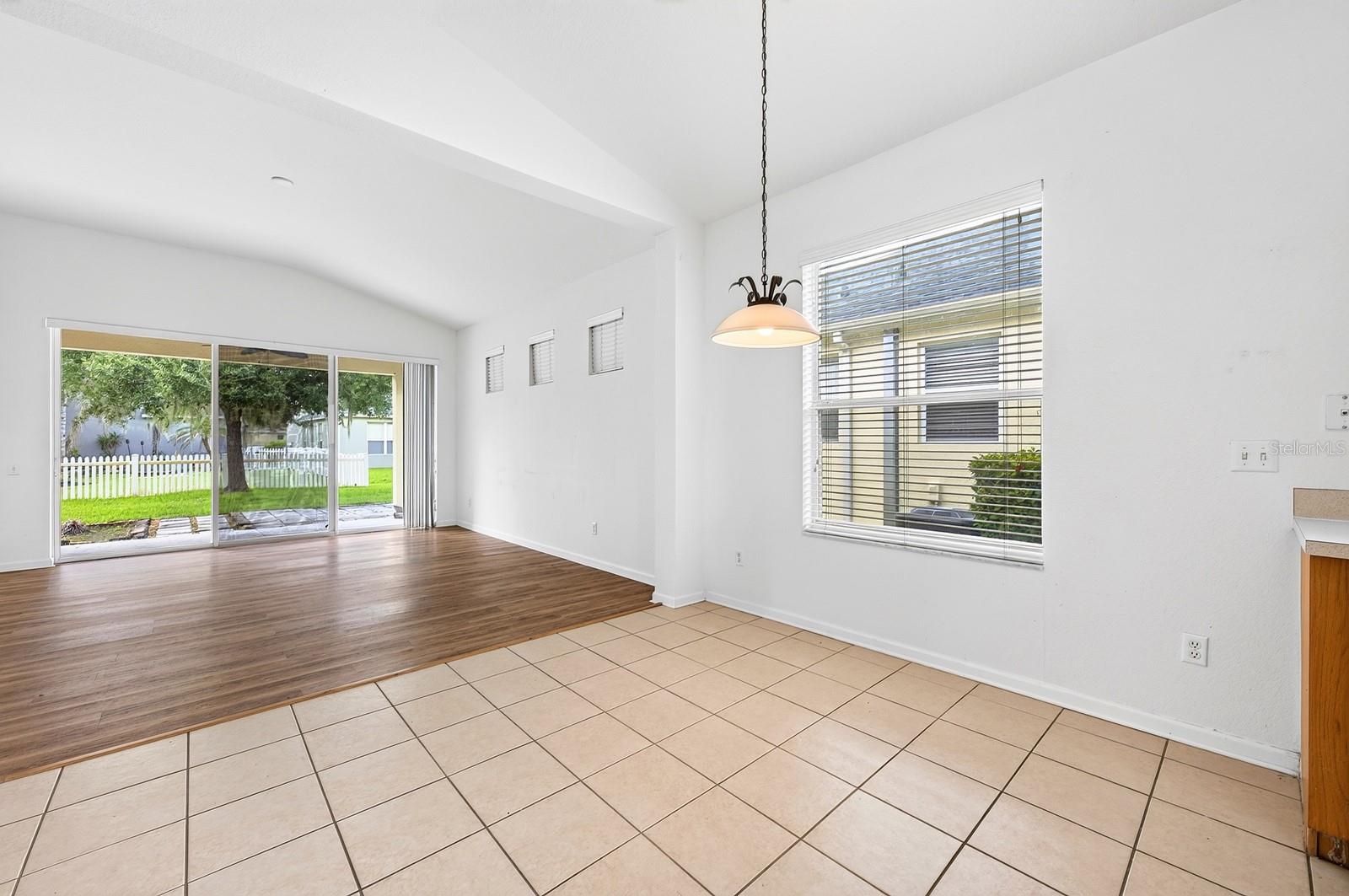 Casual dining off the kitchen, open to the family room.